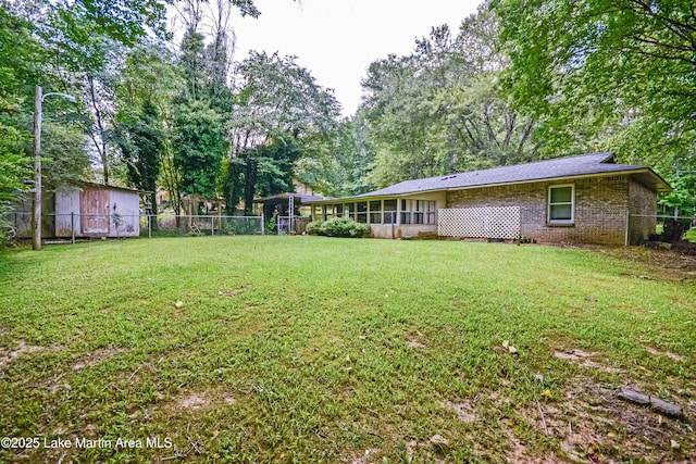3464 Dobbs Rd, Alexander City, AL 35010 - fenced backyard with a sunroom
