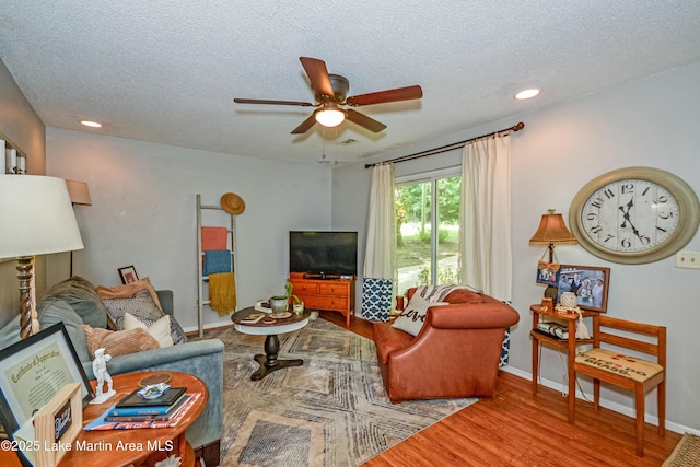 3464 Dobbs Rd, Alexander City, AL 35010 - living area with a ceiling fan, wood finished floors, a textured ceiling, and recessed lighting