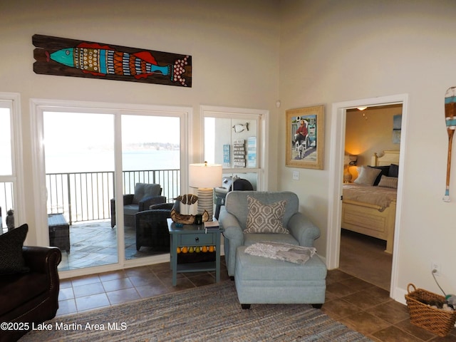 living area with dark tile patterned floors