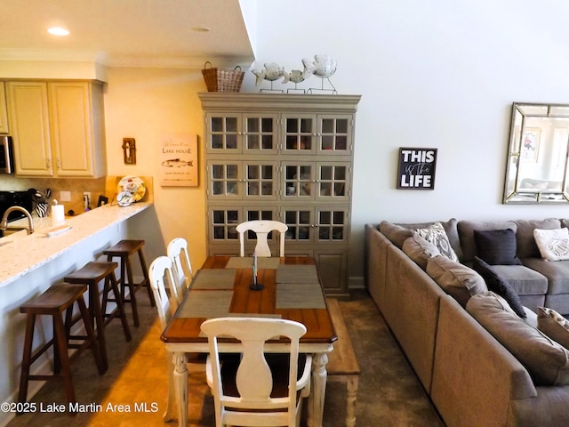 dining area featuring recessed lighting