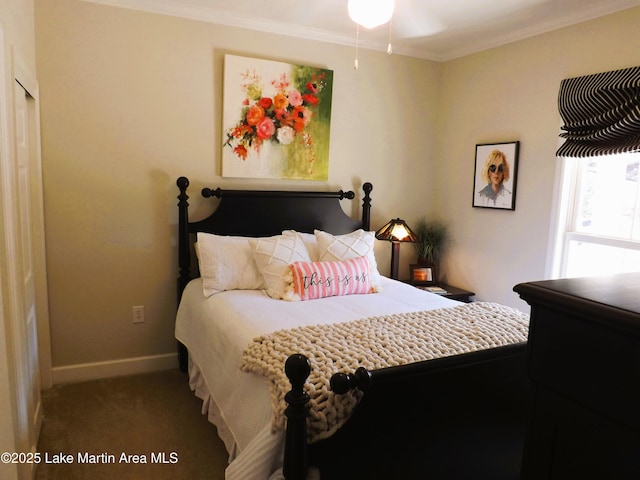 carpeted bedroom featuring baseboards and crown molding