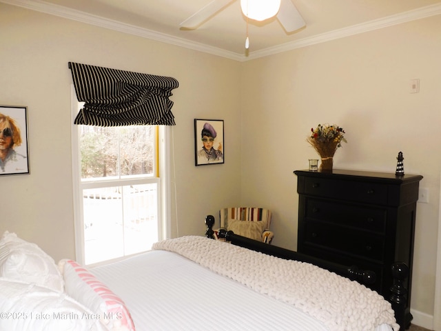 bedroom with ornamental molding and ceiling fan