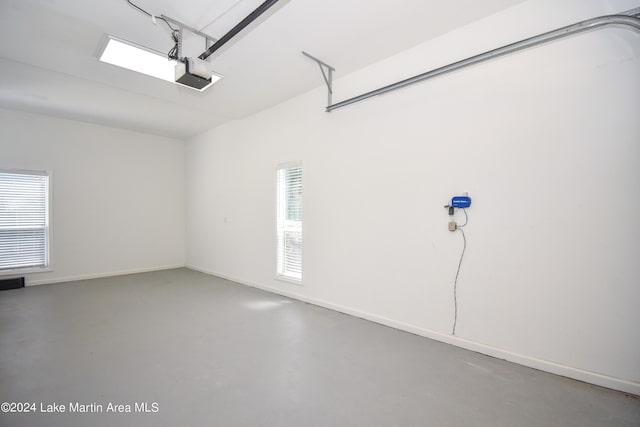 garage featuring baseboards and a garage door opener