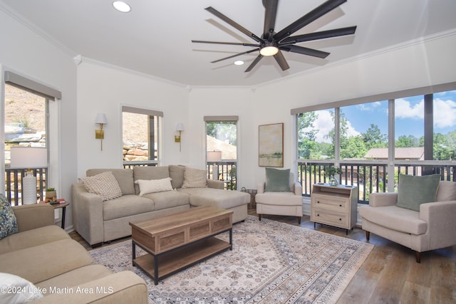 living room with ceiling fan, ornamental molding, wood finished floors, and recessed lighting