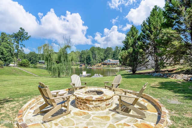 view of patio featuring a fire pit and a water view