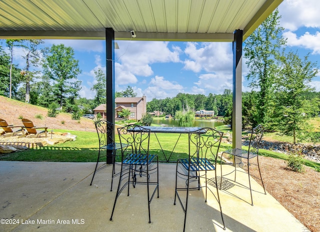 view of patio / terrace with a water view