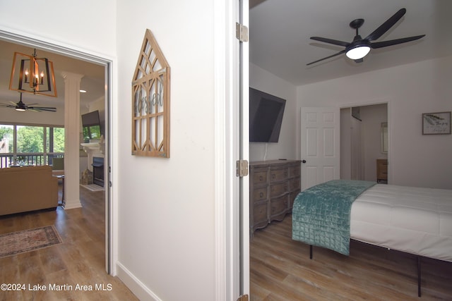 bedroom featuring baseboards and wood finished floors