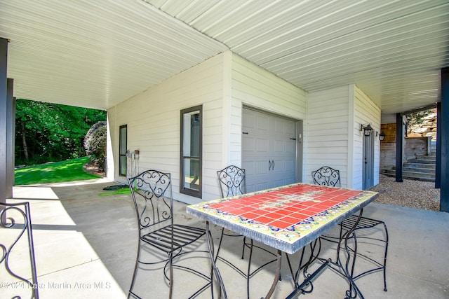 view of patio featuring a garage