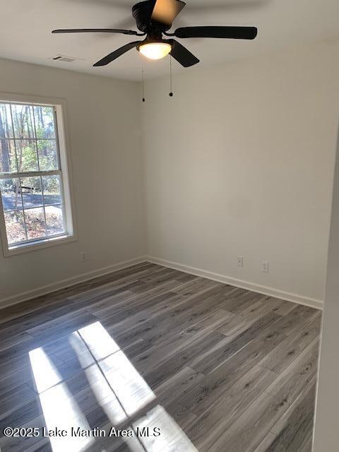 empty room featuring dark hardwood / wood-style flooring