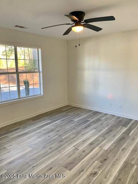 unfurnished room with light hardwood / wood-style flooring