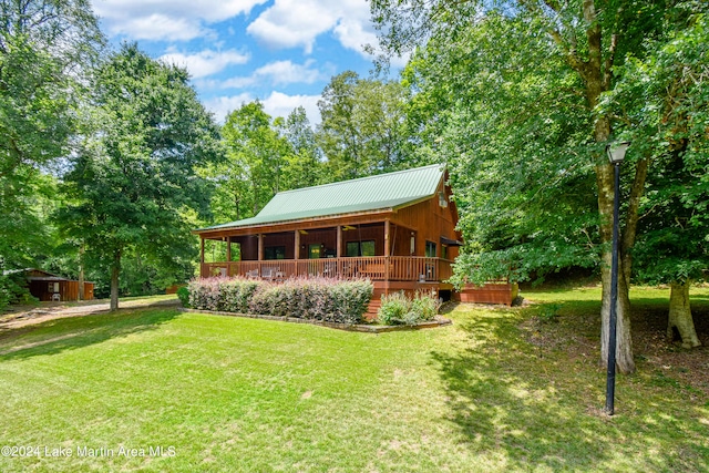 back of house with a porch and a lawn