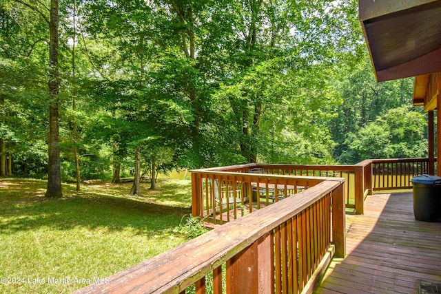 wooden deck featuring a yard