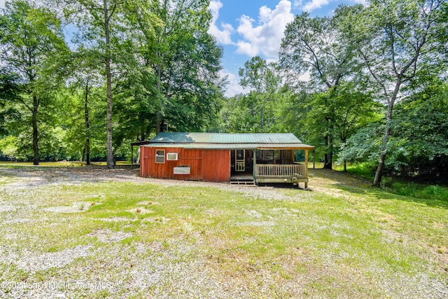 exterior space featuring a lawn and a porch