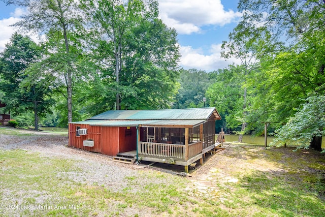 view of outbuilding with a lawn