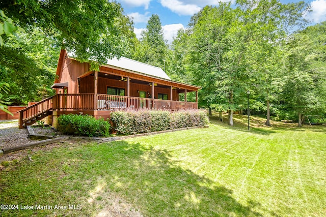 view of yard featuring a wooden deck