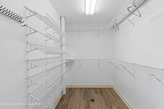 spacious closet featuring hardwood / wood-style floors