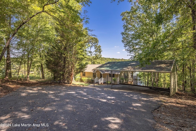 view of front of house with a porch and a carport