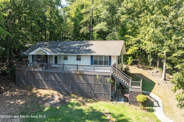 back of property featuring a wooden deck