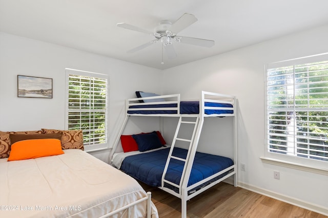 bedroom with hardwood / wood-style flooring and ceiling fan