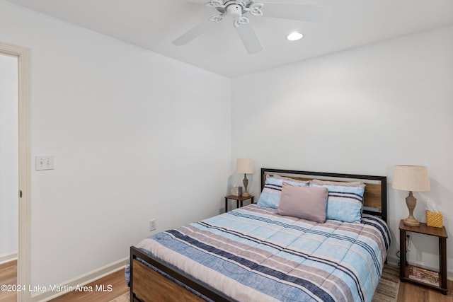 bedroom featuring ceiling fan and wood-type flooring