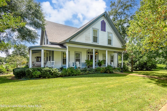 farmhouse inspired home with a front lawn