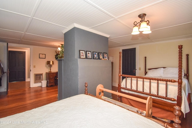 bedroom with wood-type flooring