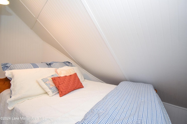 bedroom featuring lofted ceiling