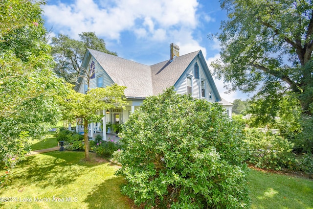 view of home's exterior with a yard