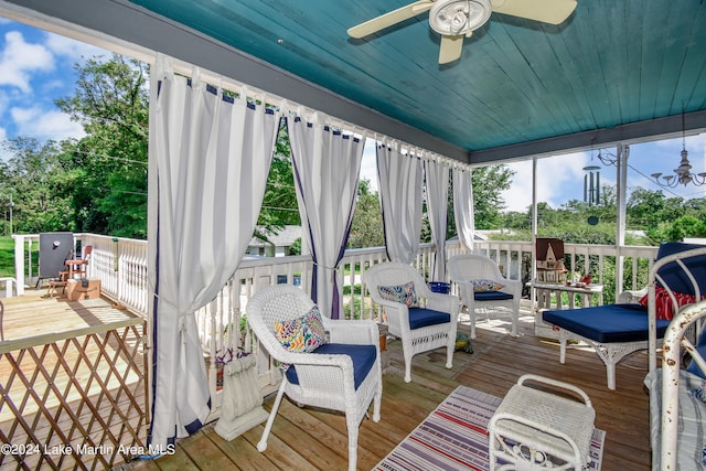 wooden terrace featuring ceiling fan