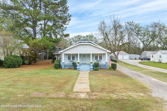 view of front of property with a front yard and a porch