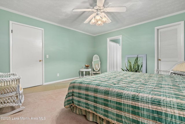 carpeted bedroom featuring ornamental molding, ceiling fan, and a textured ceiling