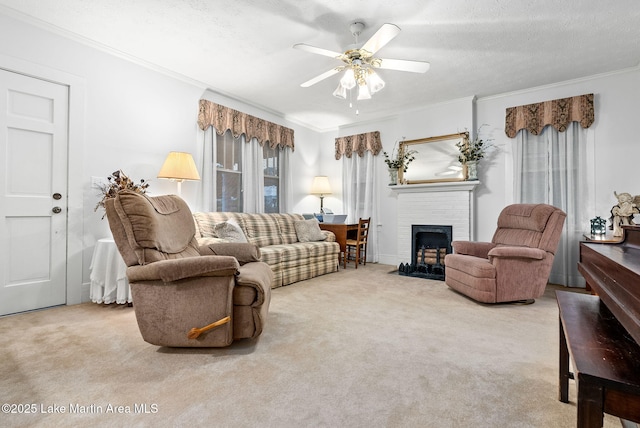 carpeted living room with ceiling fan, ornamental molding, a brick fireplace, and a textured ceiling