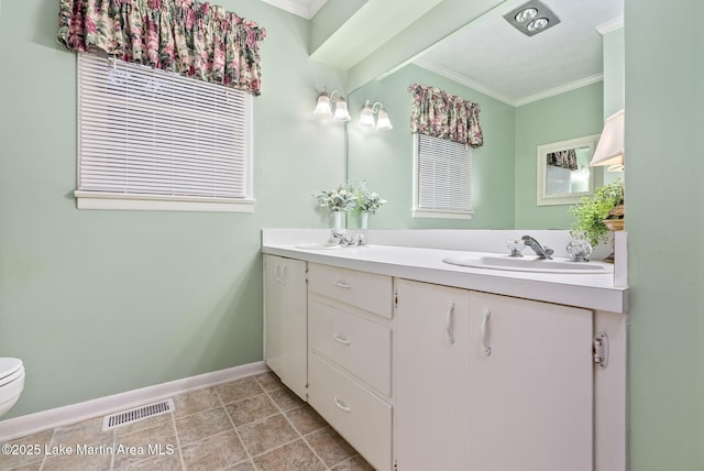 bathroom featuring ornamental molding, toilet, and vanity