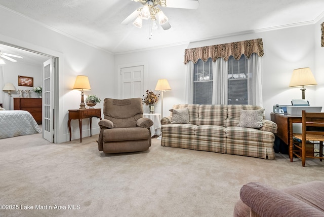 living room with crown molding, a textured ceiling, ceiling fan, and carpet