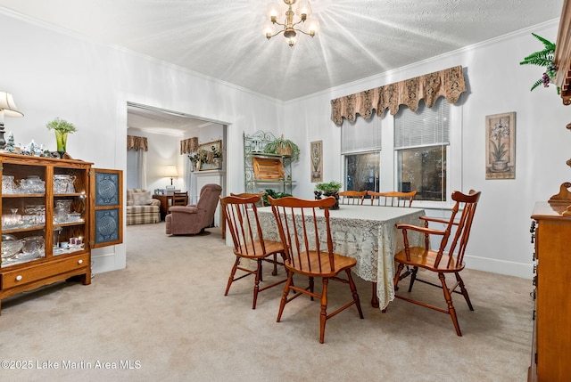 carpeted dining space featuring an inviting chandelier, crown molding, and a textured ceiling