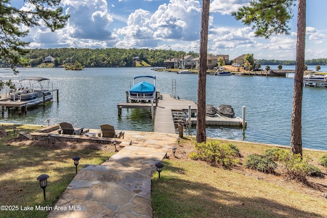 dock area with a water view and boat lift