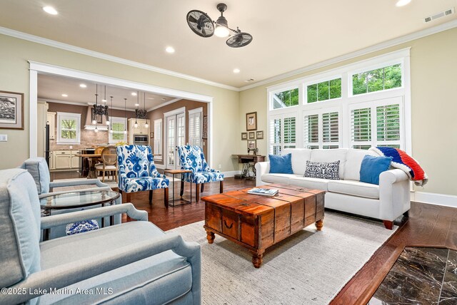 3408 Quail Cv, Opelika, AL 36801 - living room featuring baseboards, ornamental molding, recessed lighting, and wood finished floors