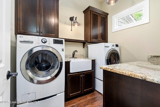 3408 Quail Cv, Opelika, AL 36801 - clothes washing area featuring cabinet space, washer and dryer, and dark wood finished floors