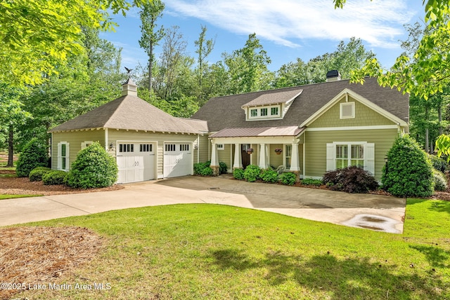 3408 Quail Cv, Opelika, AL 36801 - view of front facade featuring a chimney, a front yard, concrete driveway, and a porch