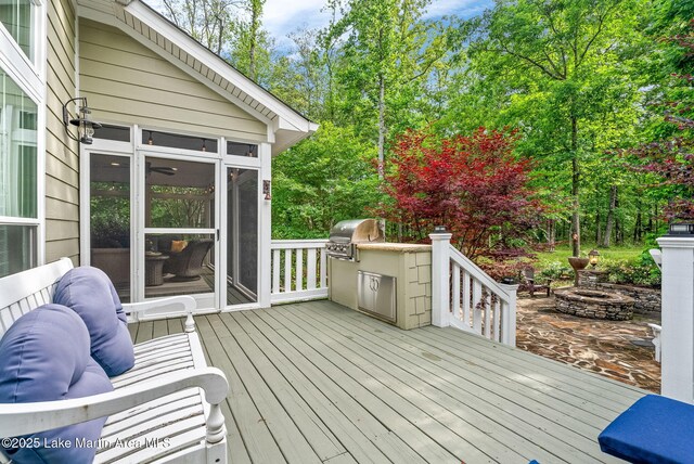 3408 Quail Cv, Opelika, AL 36801 - deck featuring area for grilling, a sunroom, and exterior kitchen