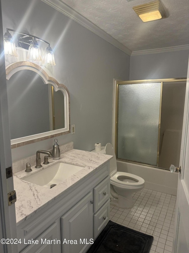 bathroom featuring enclosed tub / shower combo, ornamental molding, tile patterned flooring, a textured ceiling, and vanity