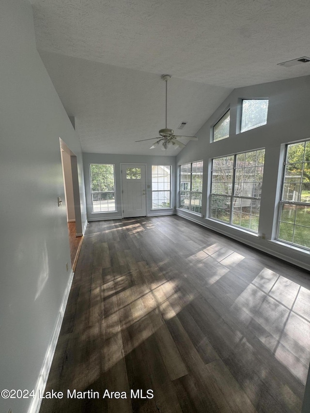 unfurnished sunroom featuring lofted ceiling and visible vents