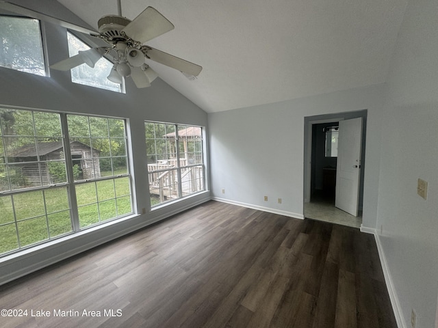 unfurnished room with high vaulted ceiling, ceiling fan, baseboards, and dark wood-type flooring