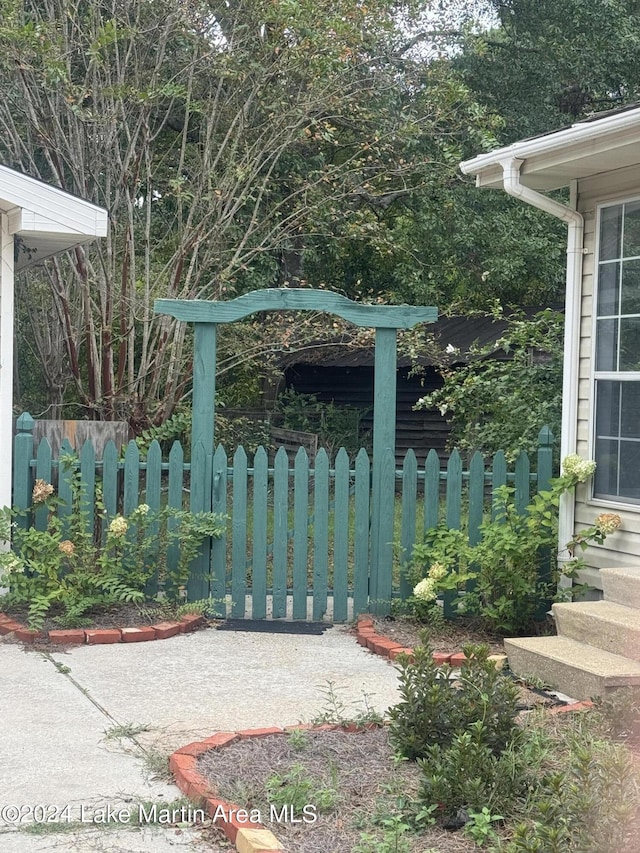 view of gate featuring fence