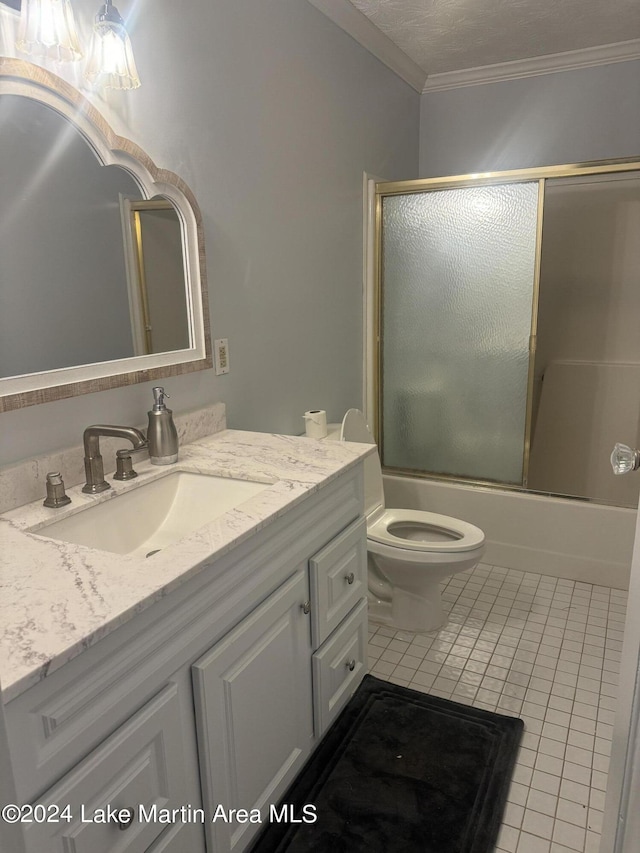 full bathroom with vanity, bath / shower combo with glass door, crown molding, and tile patterned floors