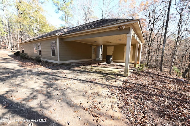 view of home's exterior featuring a carport