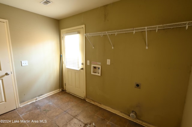 clothes washing area featuring hookup for an electric dryer and hookup for a washing machine