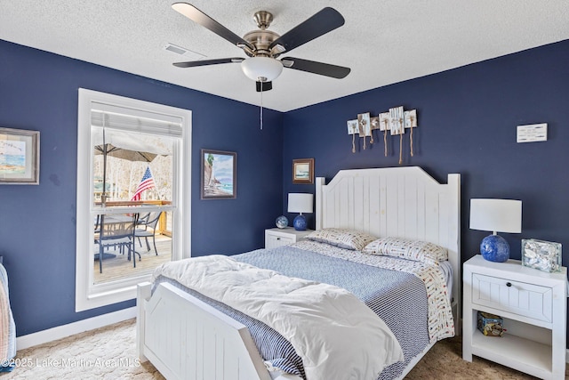 57 Lakeview Pt, Alexander City, AL 35010 - bedroom featuring ceiling fan, light colored carpet, and a textured ceiling