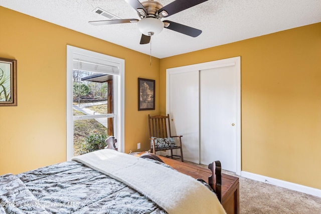 57 Lakeview Pt, Alexander City, AL 35010 - bedroom with light carpet, a closet, a ceiling fan, and a textured ceiling