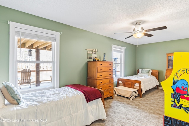 57 Lakeview Pt, Alexander City, AL 35010 - carpeted bedroom with a textured ceiling and a ceiling fan